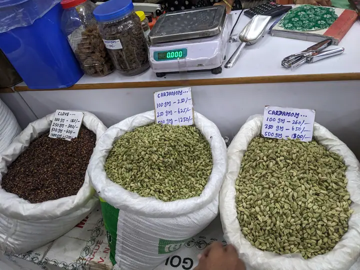 Colourful spices displayed with price labels in a shop in Munnar, Kerala.